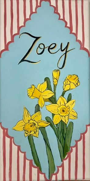Nursery name sign reading Zoey, with hand-painted daffodils